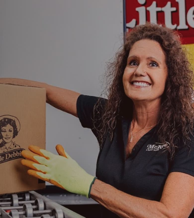 McKee Pro stands next to Little Debbie boxes